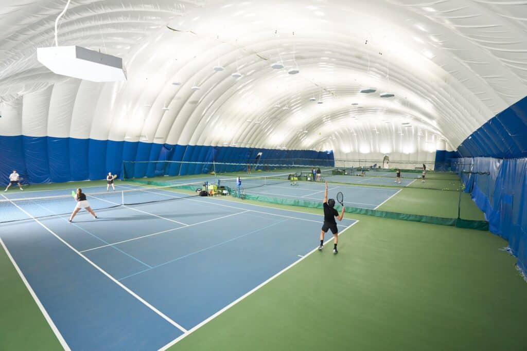 Players practicing tennis strategy before a local NYC tournament.
