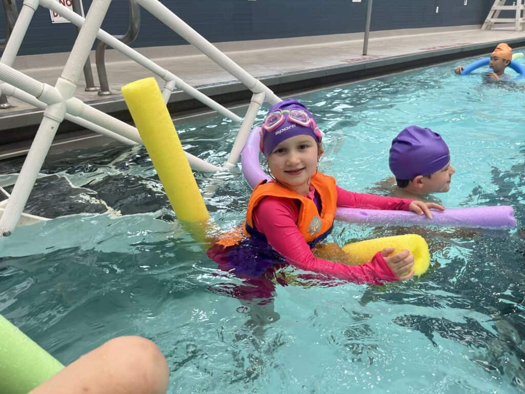 A kid in the pool at Advantage Camps.