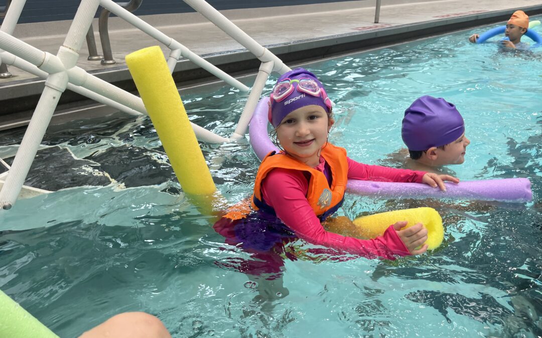 A kid in the pool at Advantage Camps.