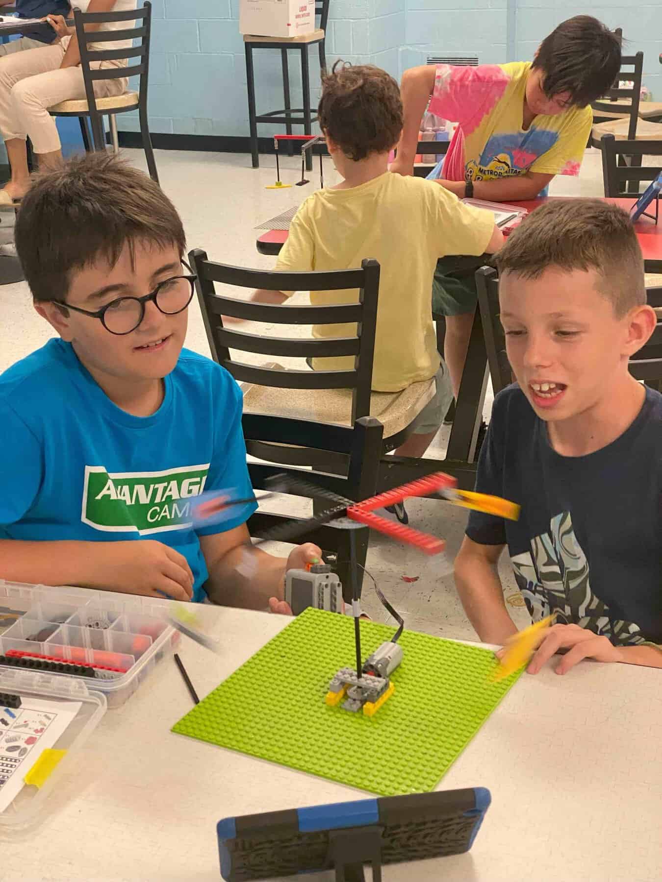 Two boys working on a science experiment at STEM camp.