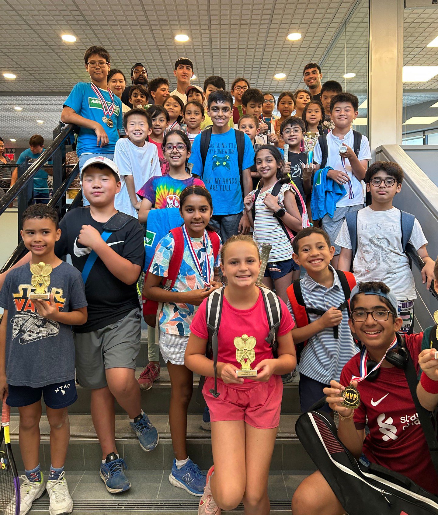 camps-overview-kids A bunch of smiling children with trophies from Advantage youth camps in New York City.