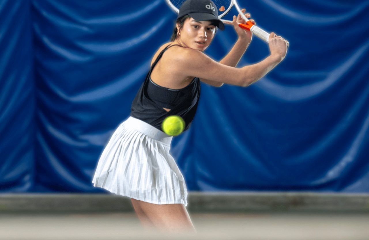 woman about to hit a ball